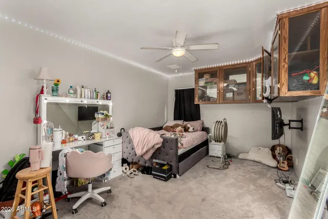 a bedroom with a workspace