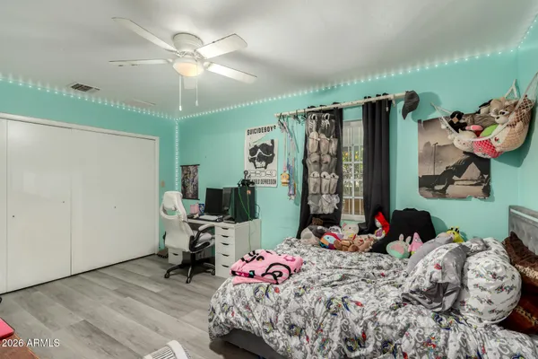 a bedroom with bed and a window