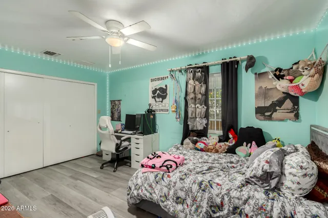 a bedroom with bed and a window