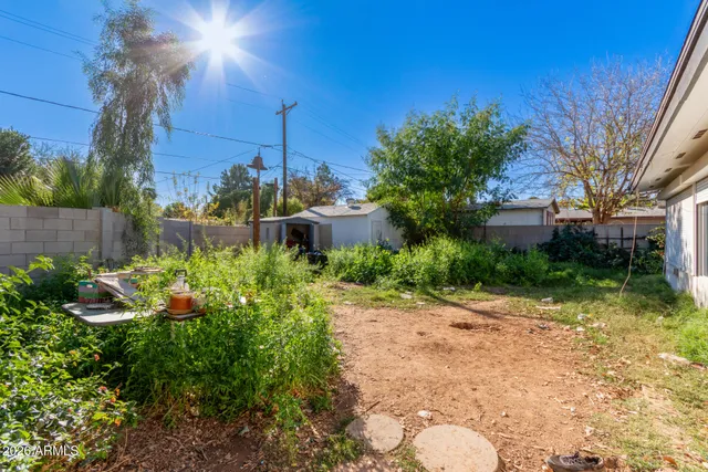 a backyard of a house with lots of green space