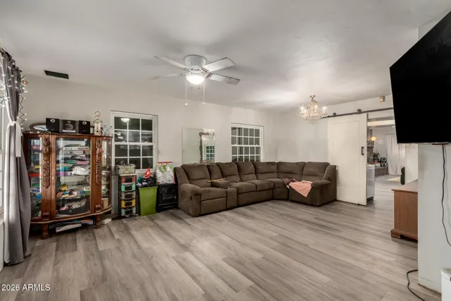 a living room with furniture and a flat screen tv