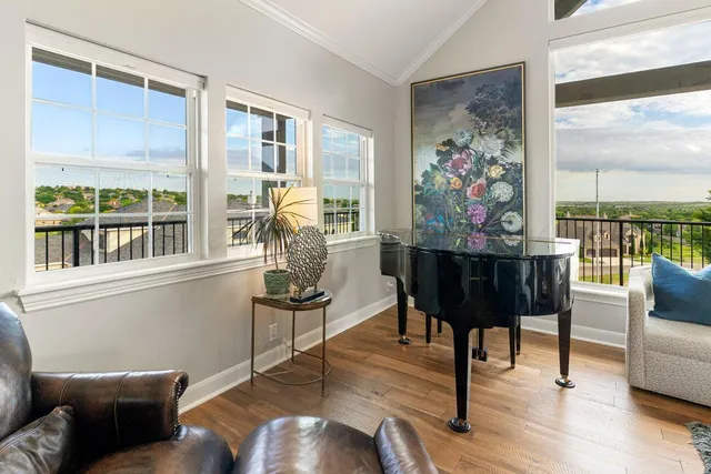 a dining room with furniture and wooden floor