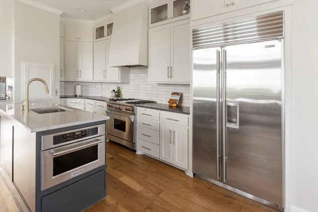 a bedroom with a bed and a potted plant