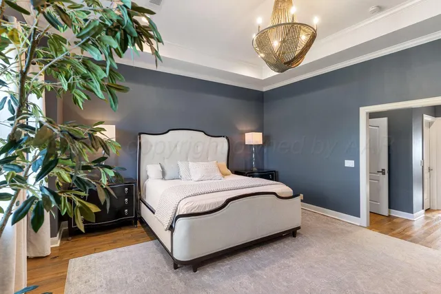 a bedroom with a bed couch and window