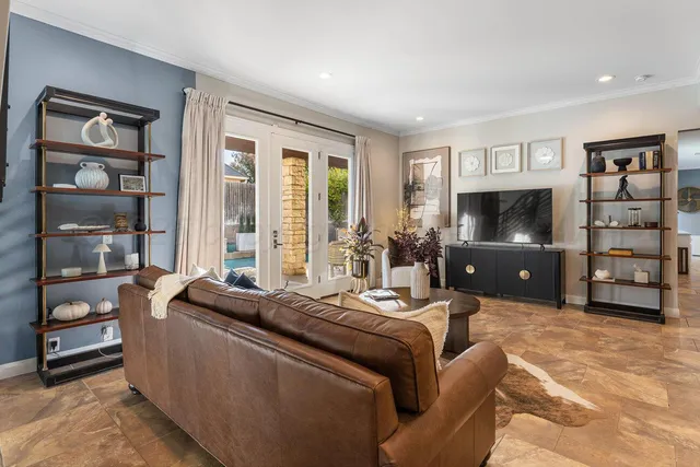 a bedroom with a bed and a painting on the wall