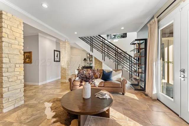 a backyard of a house with table and chairs