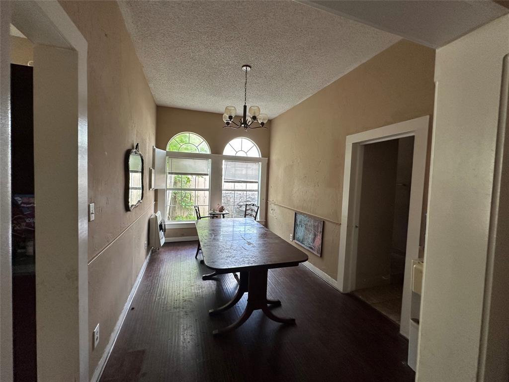 1405 Caddo Street Commerce, TX 75428 - Photo 8 of 8 a view of a livingroom with furniture window and wooden floor