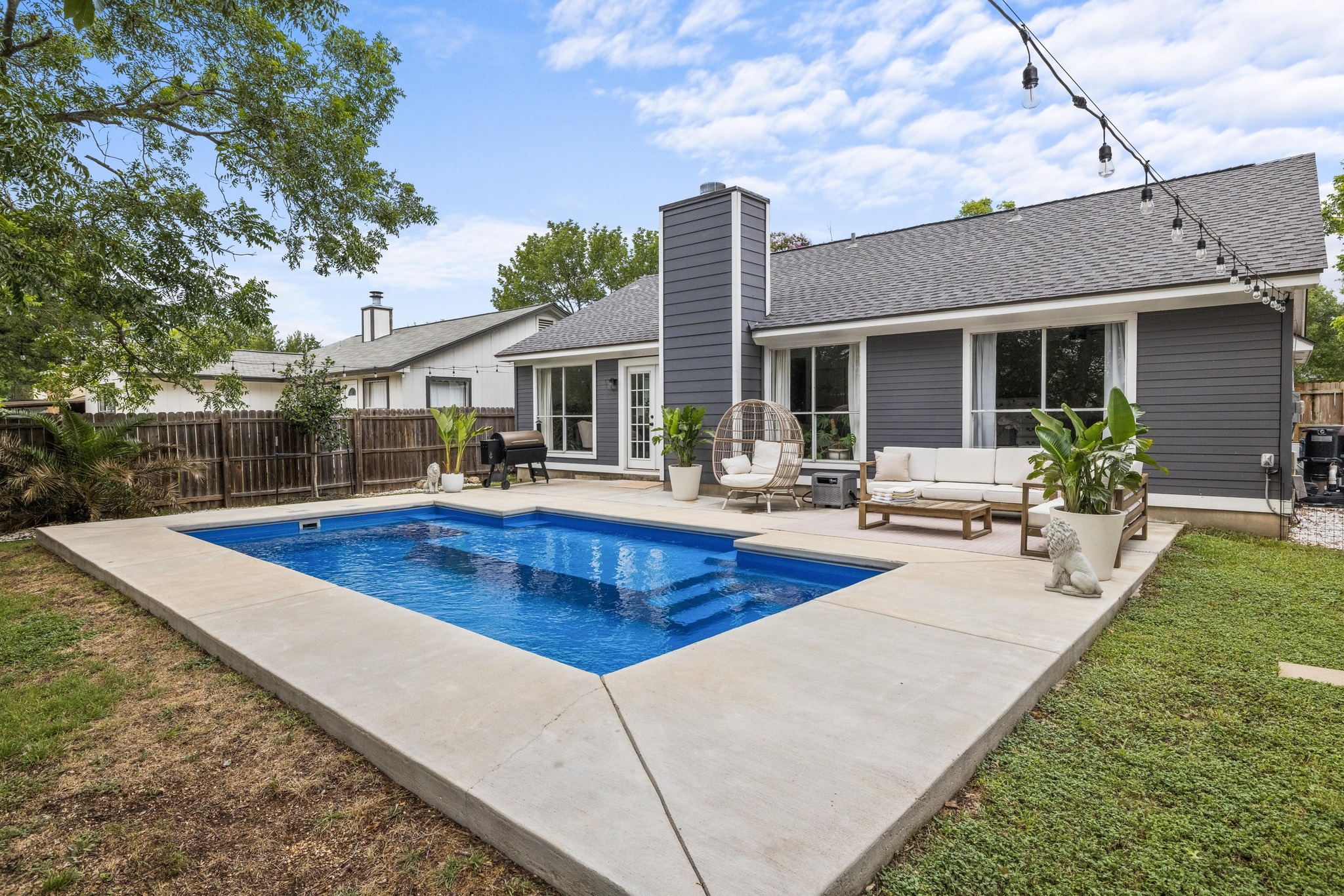 1205 Rambling Trail Cedar Park, TX 78613 - Photo 1 of 1 View of pool from shallow end with patio and outdoor living space.