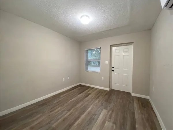 a kitchen with a stove top oven sink and cabinets