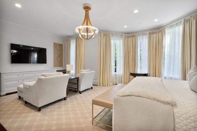 a bathroom with a granite countertop sink a mirror and a bathtub