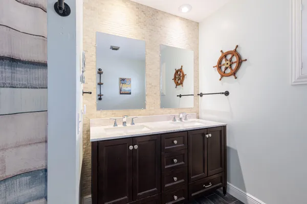 a bathroom with a sink and a mirror