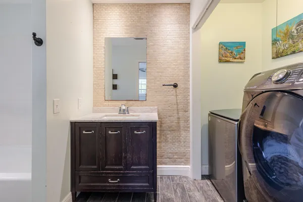 a bathroom with a sink and a mirror