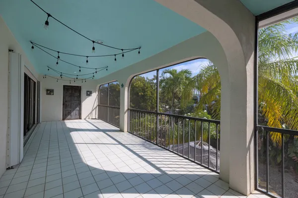 a view of balcony with furniture