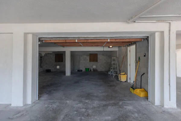 a view of a room with wooden floor and furniture
