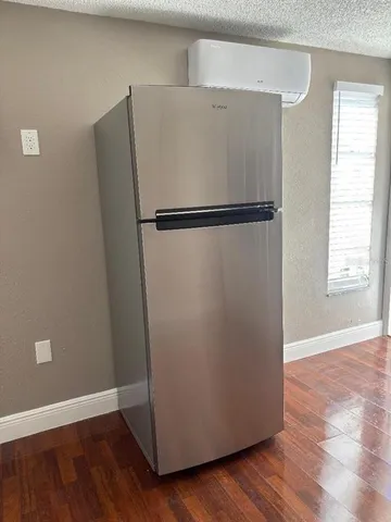 a view of a refrigerator in a kitchen