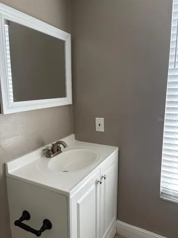 a utility room with a sink dryer and washer