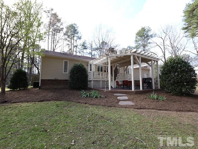 11908 Old Creedmoor Road Raleigh, NC 27613 - Photo 14 of 16 a view of a yard in front of a house