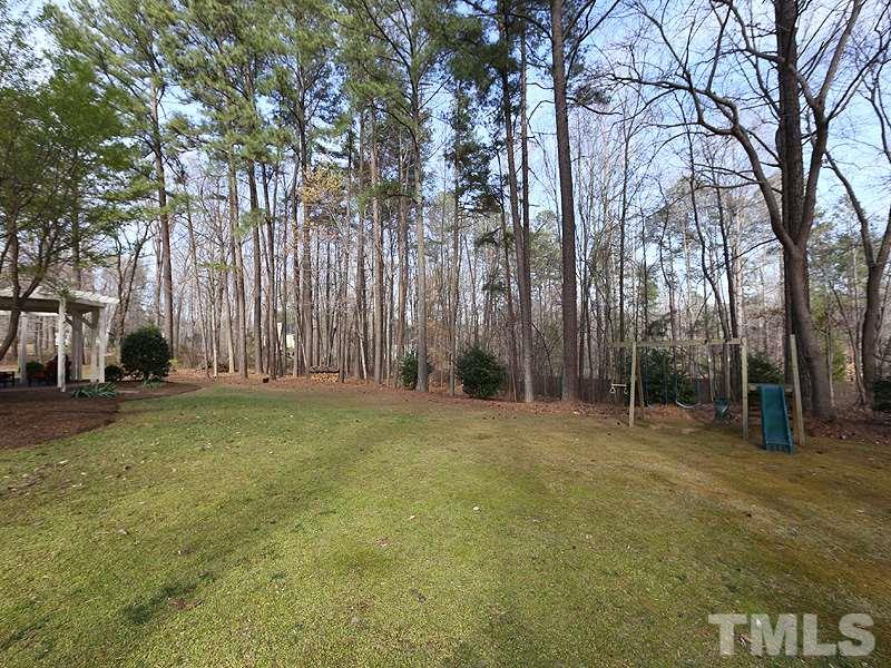 11908 Old Creedmoor Road Raleigh, NC 27613 - Photo 15 of 16 a view of a field with trees in the background