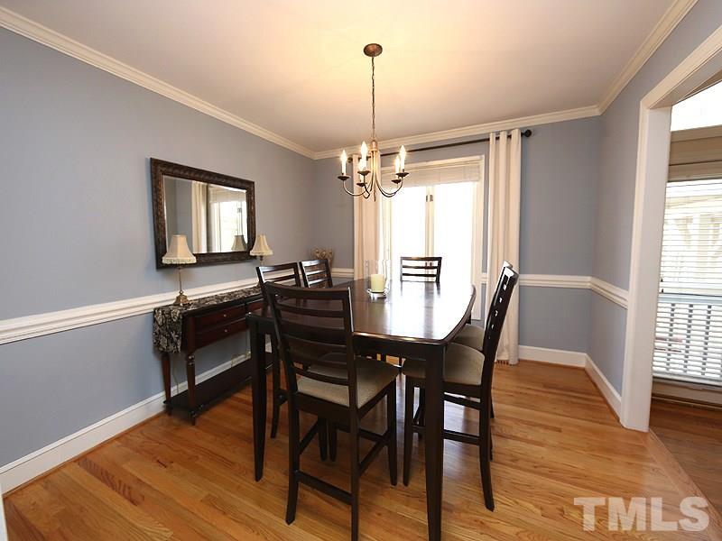 11908 Old Creedmoor Road Raleigh, NC 27613 - Photo 4 of 16 a view of a dining room with furniture window and wooden floor