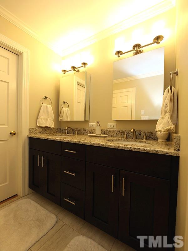 11908 Old Creedmoor Road Raleigh, NC 27613 - Photo 9 of 16 a bathroom with a granite countertop sink and a mirror