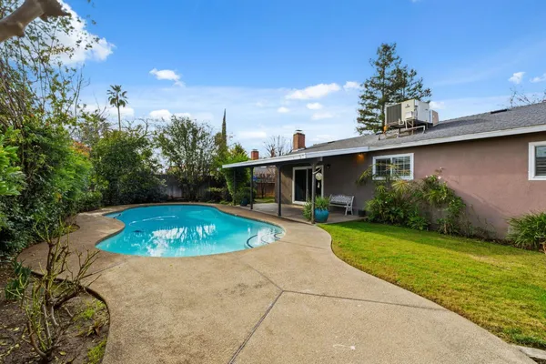 a view of a house with swimming pool