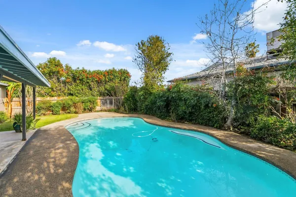 a backyard of a house with lots of green space