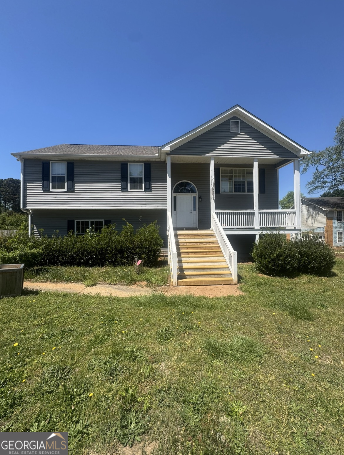 450 Bee Maxey Road Winder, GA 30680 - Photo 1 of 1 a front view of a house with garden
