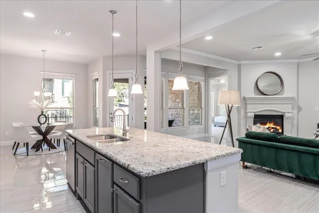 a kitchen with granite countertop cabinets and a stove top oven