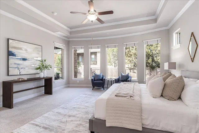 a spacious bedroom with a bed and a couch