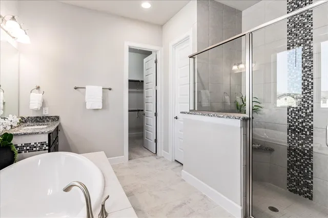 a spacious bathroom with a sink double vanity and a mirror