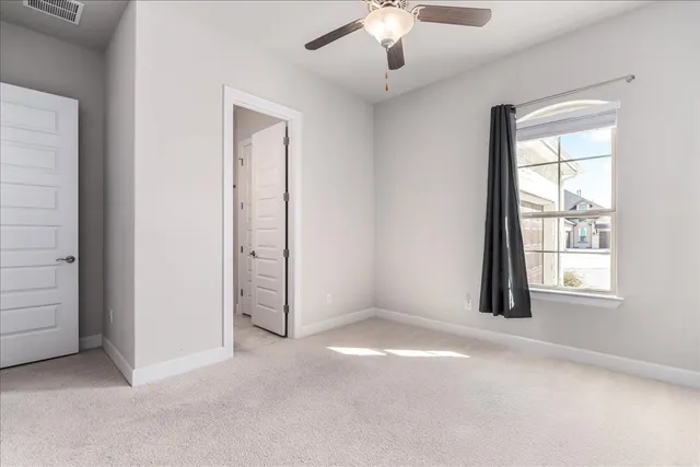 a view of a hallway with seating area