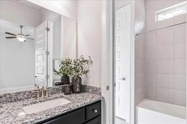 a view of a big room with windows and chandelier