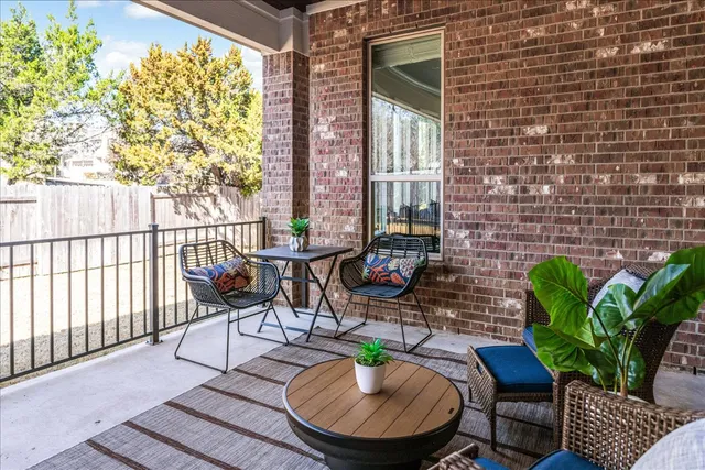 a outdoor space with patio couches and a potted plant