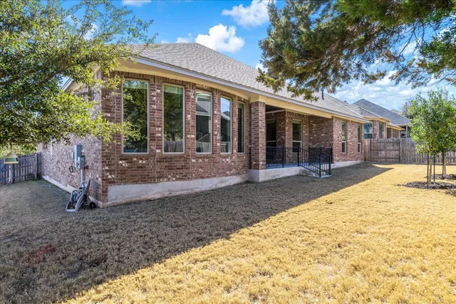 a view of a backyard with a patio