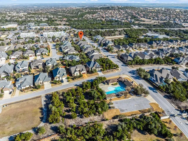 a view of a house with backyard porch and sitting area