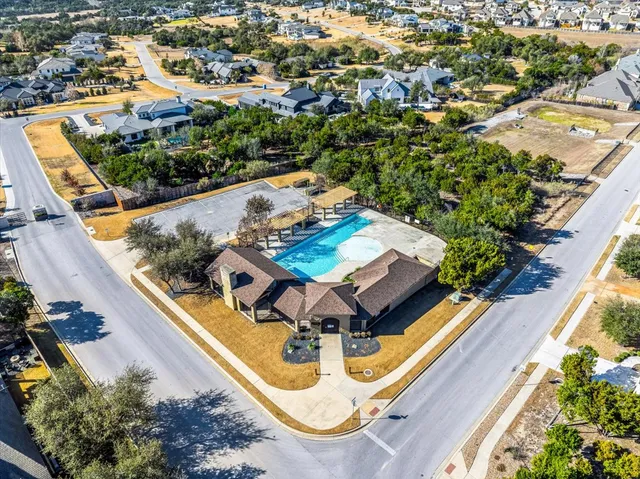 an aerial view of multiple houses with a city