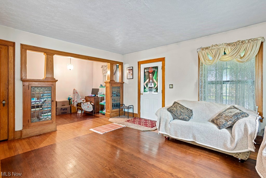 Living room featuring hardwood floors and a nice attached office