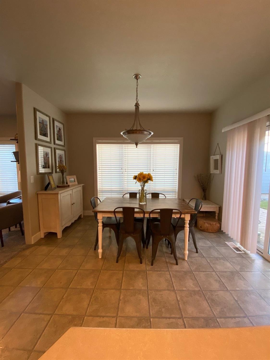 1135 Rustler Peak Street Central Point, OR 97502 - Photo 8 of 17 a view of a dining room with furniture and window