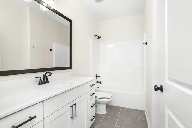 a kitchen with cabinets wooden floor and a sink