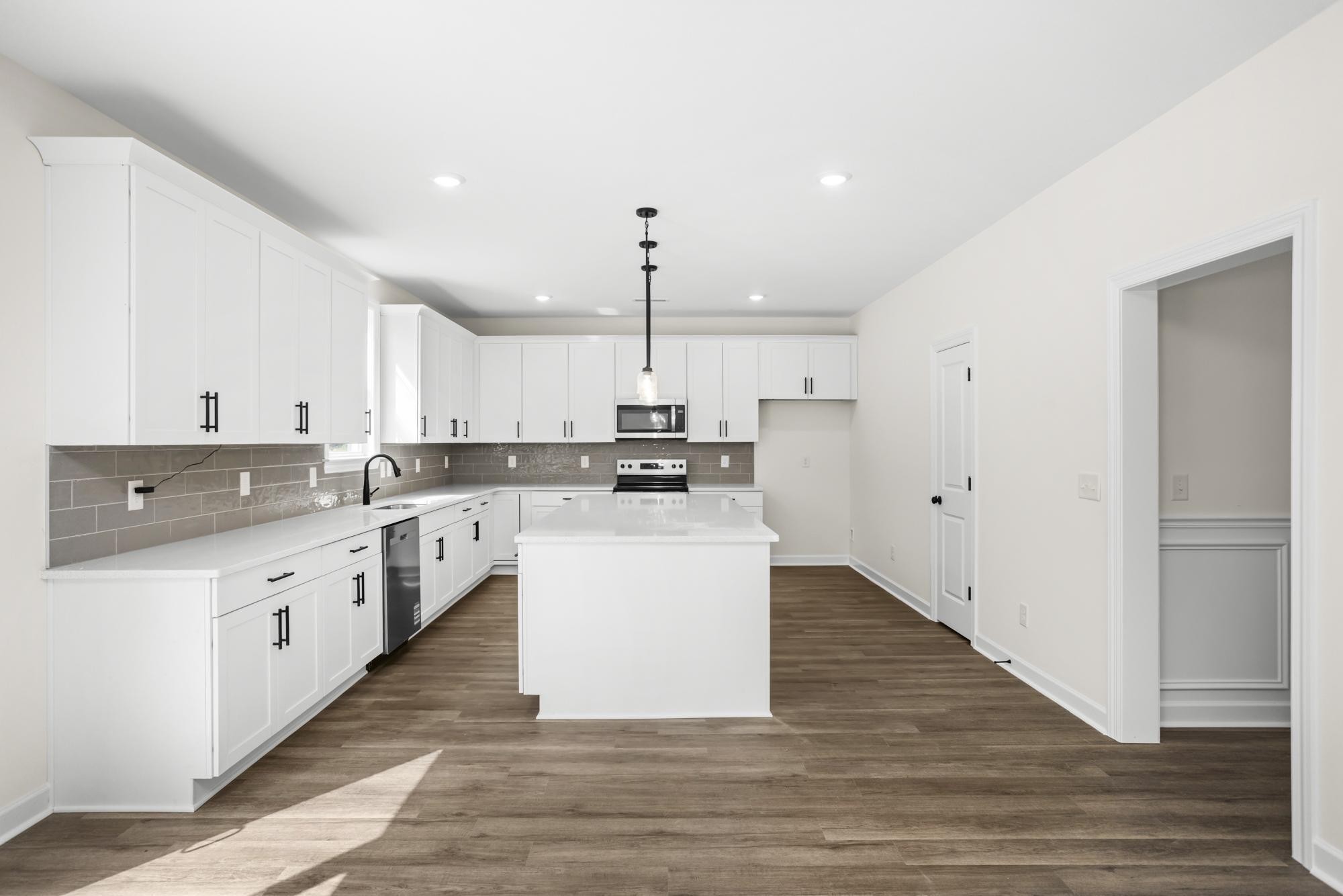 4014 Rampart Way Spring Hill Spring Hill, TN 37174 - Photo 14 of 48 a kitchen with cabinets wooden floor and a sink