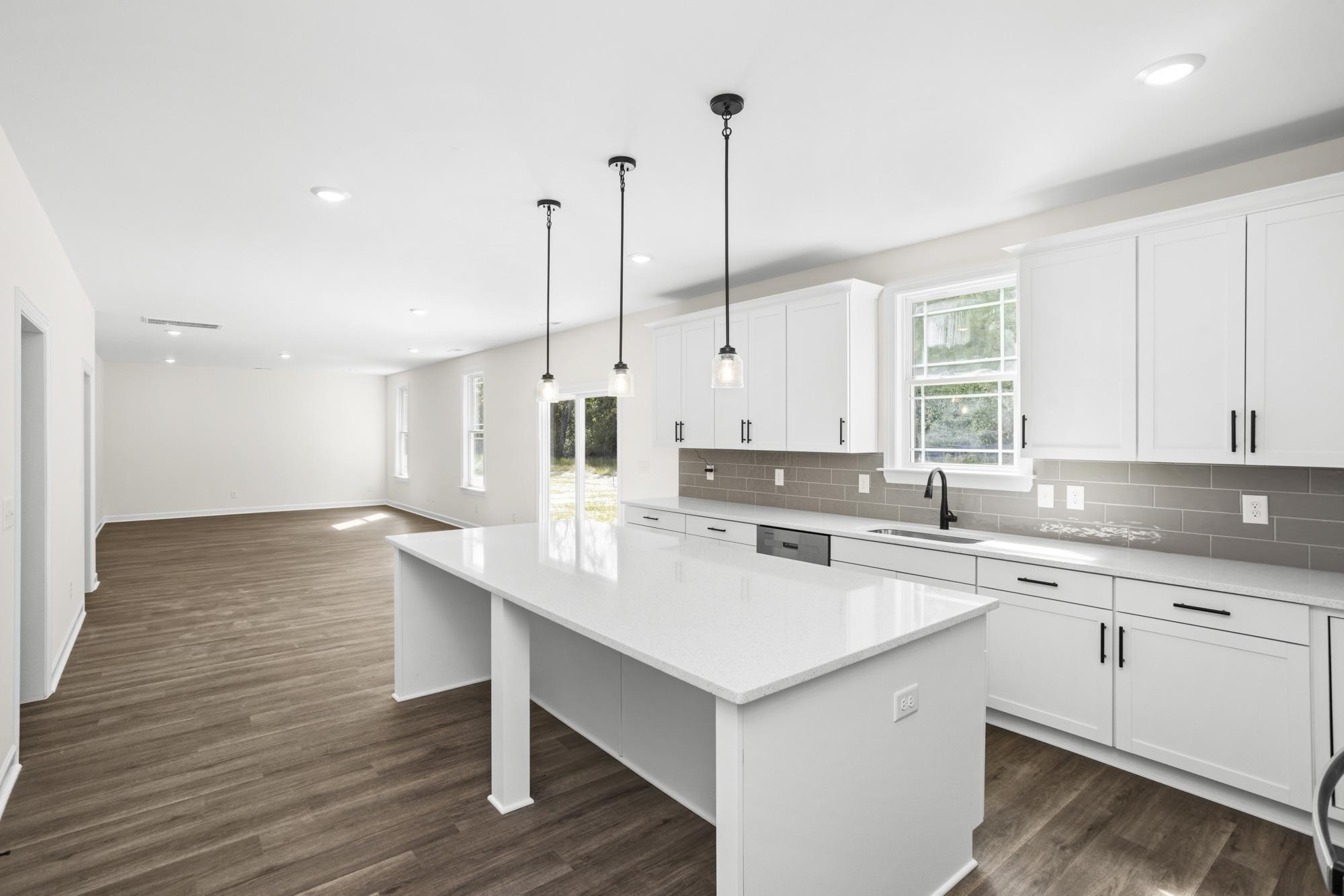 4014 Rampart Way Spring Hill Spring Hill, TN 37174 - Photo 16 of 48 a kitchen with a sink stove and wooden floor
