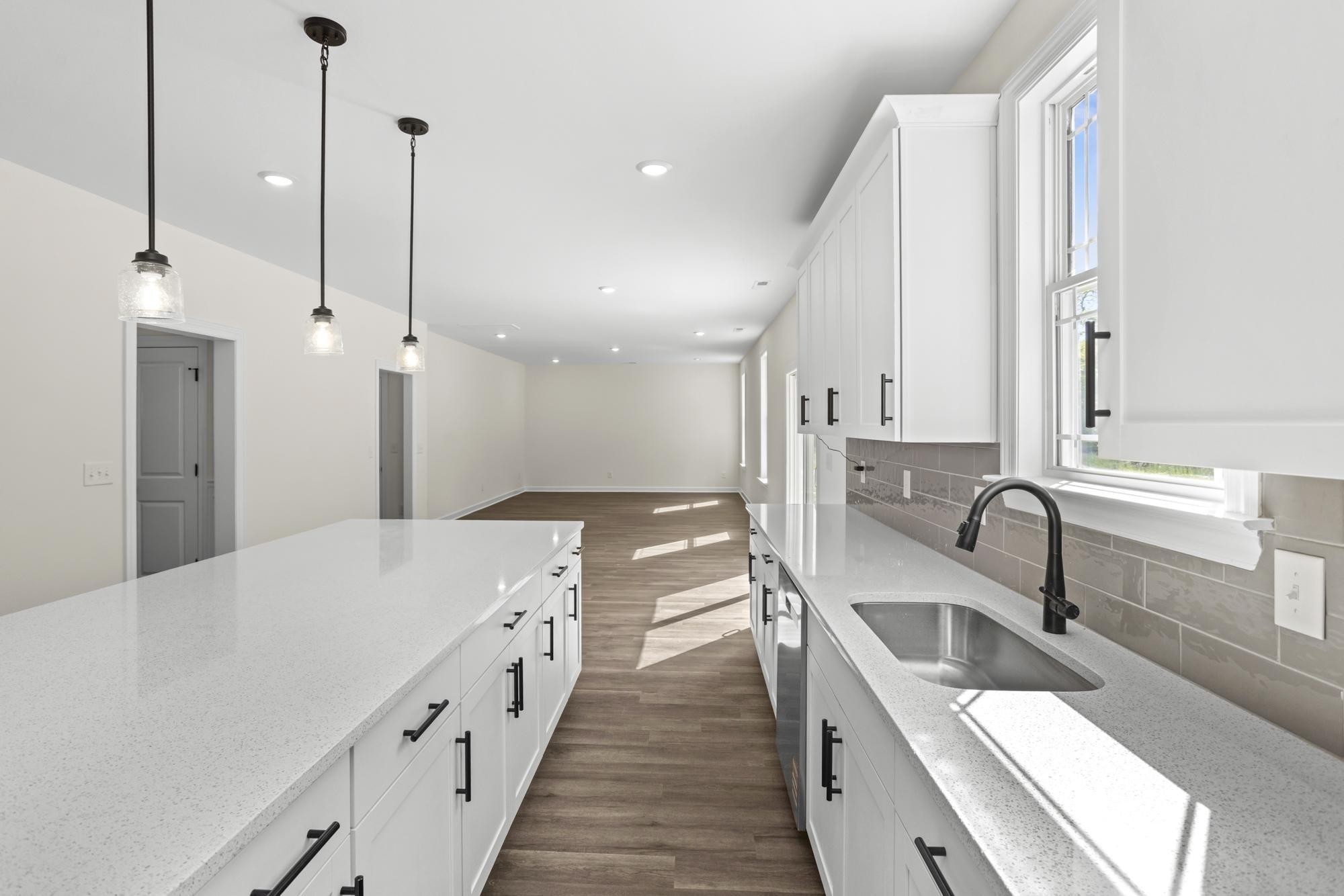 4014 Rampart Way Spring Hill Spring Hill, TN 37174 - Photo 17 of 48 a large white kitchen with a sink a counter top space and stainless steel appliances