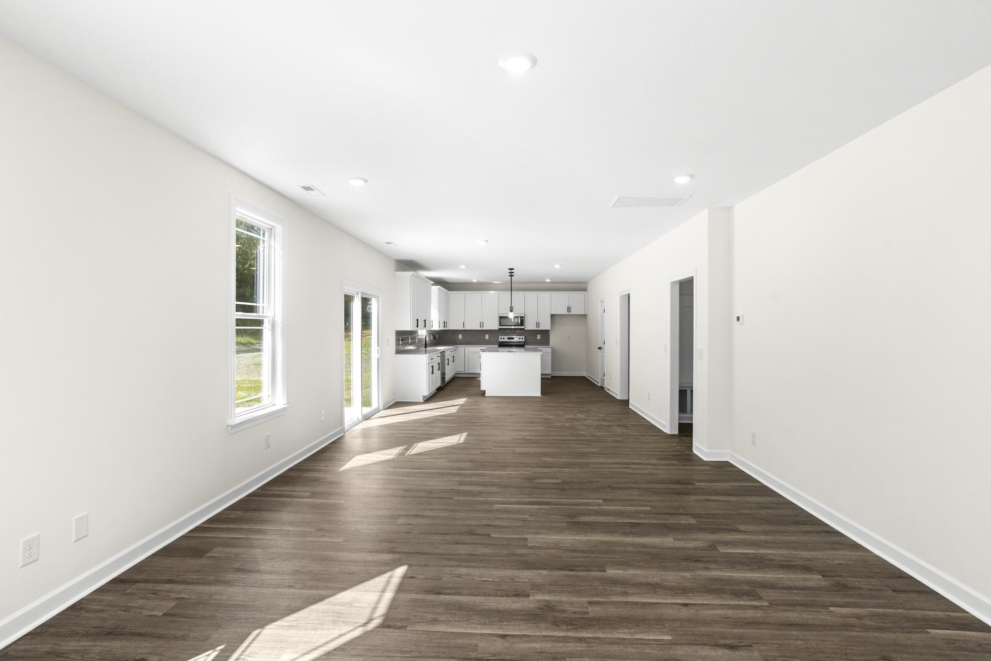 4014 Rampart Way Spring Hill Spring Hill, TN 37174 - Photo 20 of 48 a view of a living room with kitchen furniture and wooden floor
