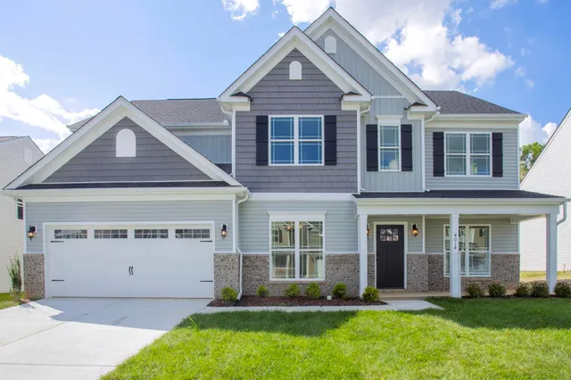 front view of a house with a yard