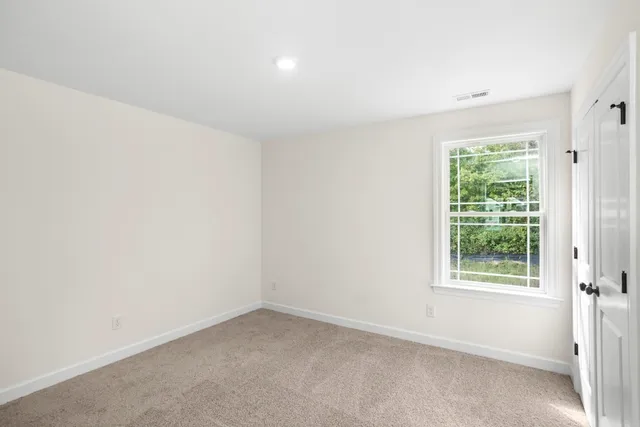 a bathroom with a double vanity sink toilet and shower