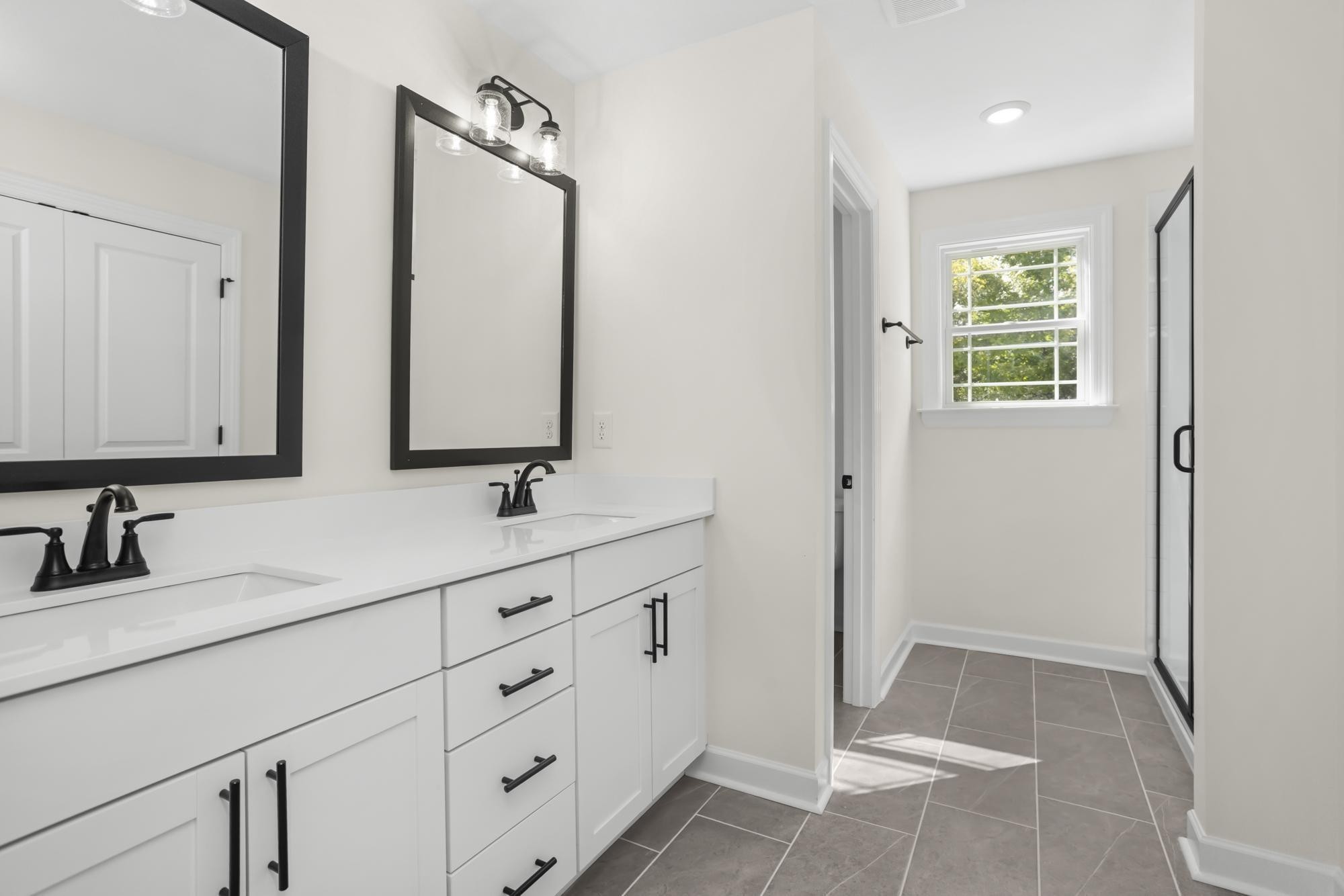 4014 Rampart Way Spring Hill Spring Hill, TN 37174 - Photo 42 of 48 a bathroom with double vanity sink and a mirror