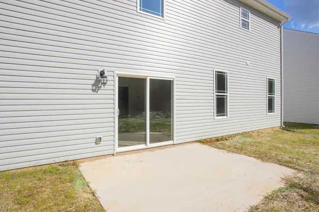a view of a swimming pool with an outdoor space and seating area