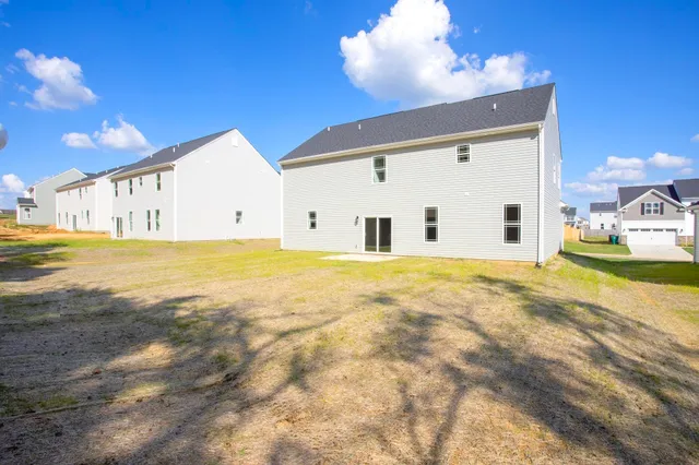 a view of backyard with swimming pool