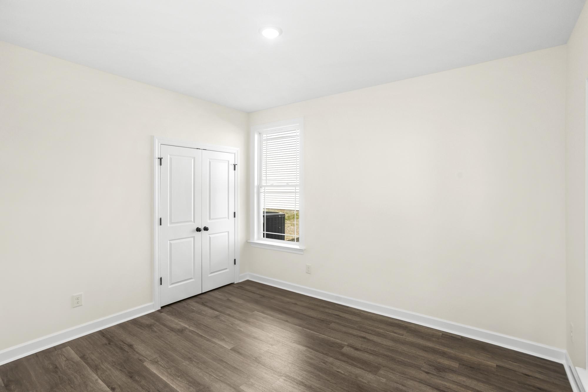 4014 Rampart Way Spring Hill Spring Hill, TN 37174 - Photo 7 of 48 a view of an empty room with wooden floor and closet