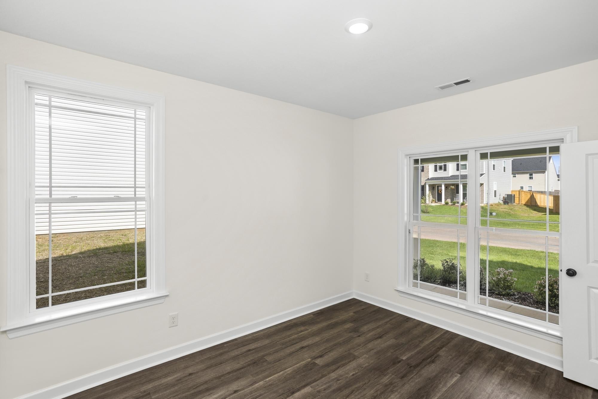 4014 Rampart Way Spring Hill Spring Hill, TN 37174 - Photo 8 of 48 a view of an empty room with wooden floor and a window
